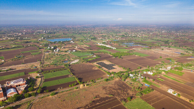 Aerial View of Indian Countryside Farmlands with Private Helipads and Agricultural Landscape