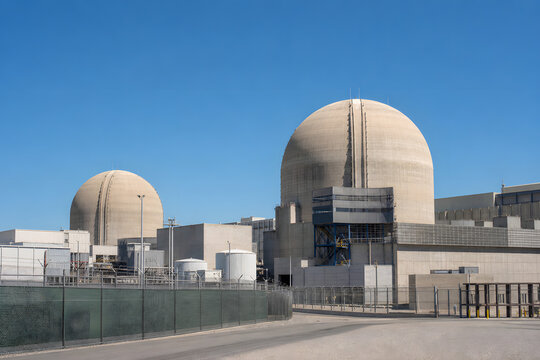 Modern nuclear power plant under clear blue sky