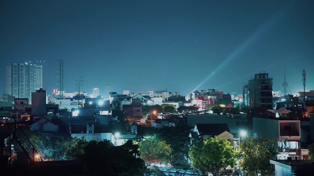 urban night cityscape with glowing residential Da Nang skyline and modern architecture lights, aerial evening view of illuminated city skyline with rooftops and calm atmosphere of Danang, Vietnam 4k