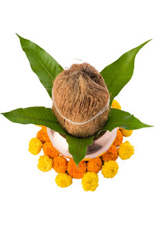 Copper Kalash decorated with flowers, mango leaf and coconut for Hindu Puja