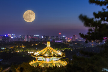 Full Moon Over Traditional Pagoda, Beijing Skyline at Night © TrinhVan