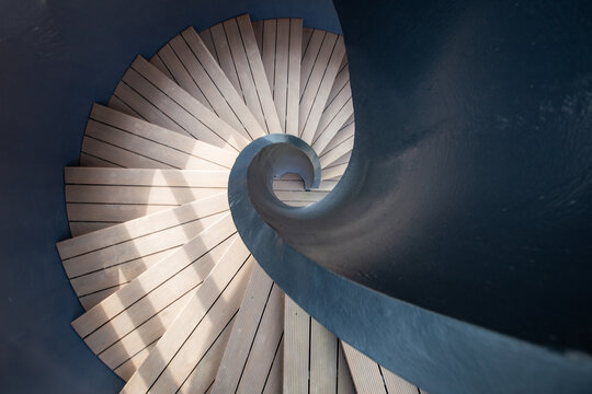 The Geometric Spiral Staircase with Rotating Steps and Sun Light