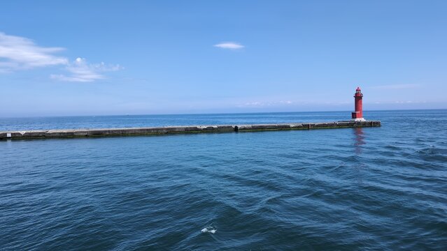 Red breakwater lighthouse at Otaru Port