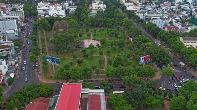 Dak Lak, Vietnam - April 29, 2026: A dynamic urban timelapse shot overlooking the central city park in Buon Ma Thuot, Dak Lak, Vietnam. 