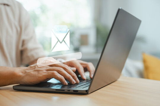 User entering email on a newsletter signup form via laptop, illustrating email marketing, lead generation, audience engagement, and digital subscription strategy for online business growth.