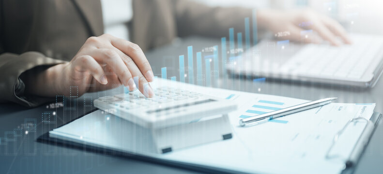 Business professional analyzing financial data with calculator, reports, and digital dashboard charts, representing accounting, ERP integration, analytics, reporting.