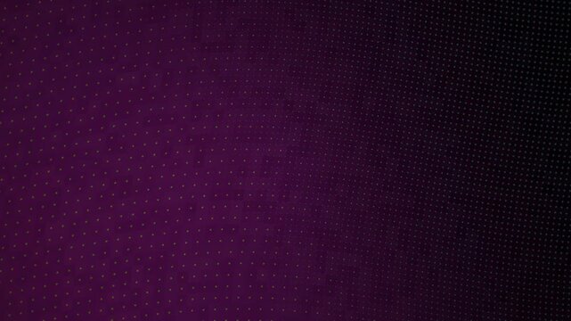 Yellow and green halftone dot pattern on dark