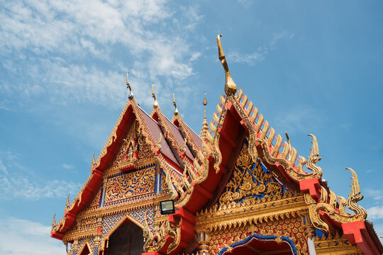 Ornate multi-tiered roof style of a historic monastery building under soft daylight.