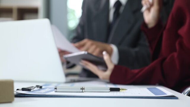 Close up of businessmen or lawyers discussing contract or business agreement at law firm office, Business people making deal document legal, justice advice service concept.
