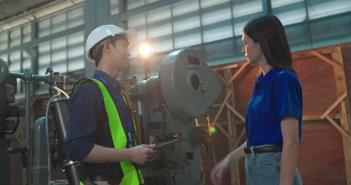 Engineer Demonstrates Product Testing Machine to Startup Entrepreneur in Small Lab Workshop