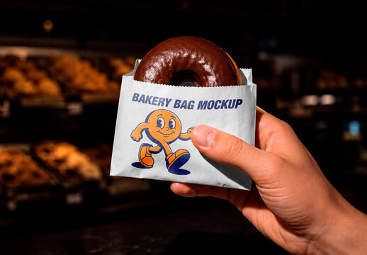 Hand Holding Paper Bag with Donut Mockup