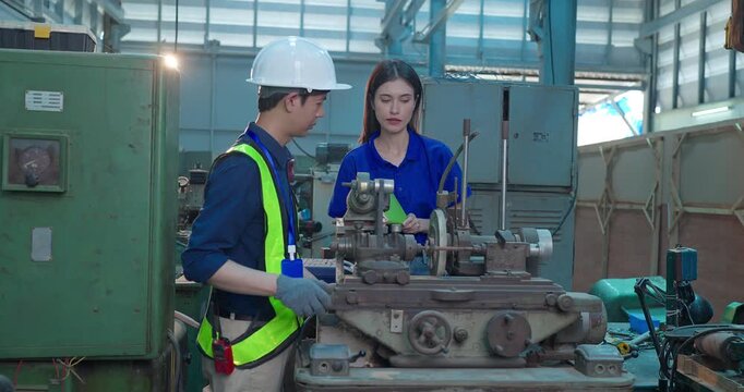 Engineer Demonstrates Product Testing Machine to Startup Entrepreneur in Small Lab Workshop