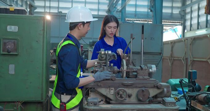 Engineer Demonstrates Product Testing Machine to Startup Entrepreneur in Small Lab Workshop