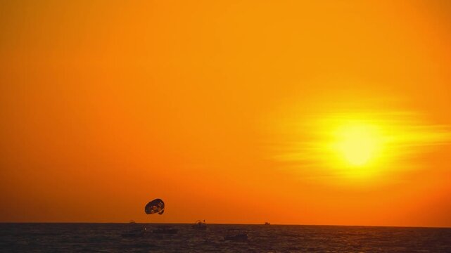 Parasailing at Sunset over Ocean