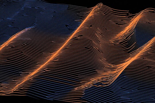 A blue and orange wavy pattern on a black background