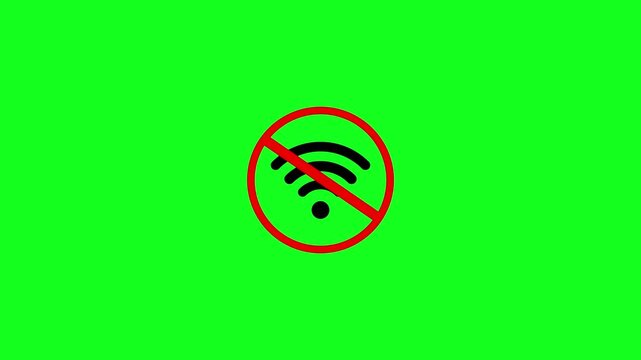 A black wifi signal crossed out by a red circle with a diagonal line isolated on a green background representing no internet connection access