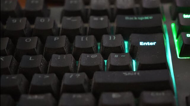 RGB mechanical gaming keyboard turning off and on, concept of computer shutdown or cyber attack