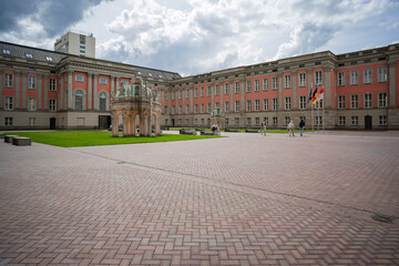 Obraz premium Inner courtyard of City Palace with classical architecture and domed pavilions, Potsdam, Germany
