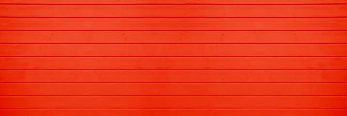 Fototapeta premium red scarlet painted wooden planks background with subtle wood grain texture Wide view coral wooden plank background vertical lines, ideal for texture pattern or spring season backdrop Springtime