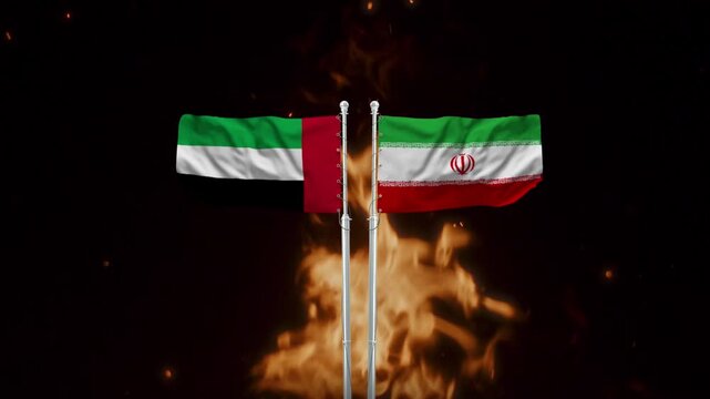 United Arab Emirates and Iran flags waving in dramatic fire motion footage