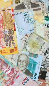 Bahamian dollar money banknotes bunch on table. Bahamas bills of BSD currency close up