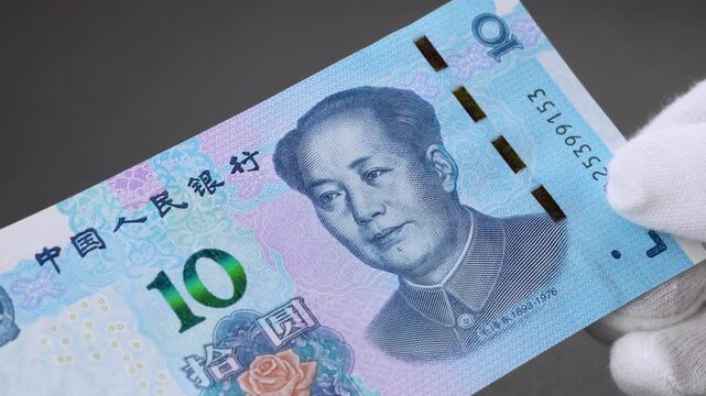 10 Yuan Banknote in hands, China, hands-on overview of Chinese paper money, footage	