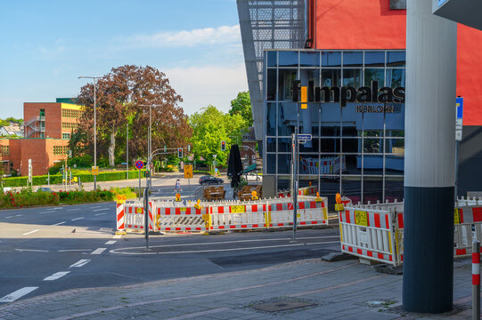 Iserlohn Germany June 20 2026 Filmpalast cinema with glass facade construction barriers and pedestrians