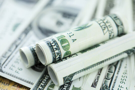 Rolled US Dollar Banknotes on Cash Background