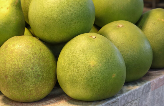 Close-up of Fresh Ripe Pomelo Fruits at a Market