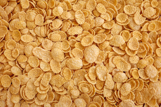cornflake cornflakes corn flakes background - close up of a pile of cereal