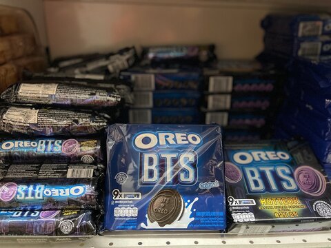 Negeri Sembilan, Malaysia - June 21, 2026: Close up shot of limited edition Oreo BTS collaboration sandwich cookies packages, including original and hotteok flavors, stacked on a supermarket shelf.