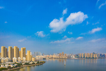 Panoramic Waterfront City View with Modern Skyline and Sailboat © HoangNgoc
