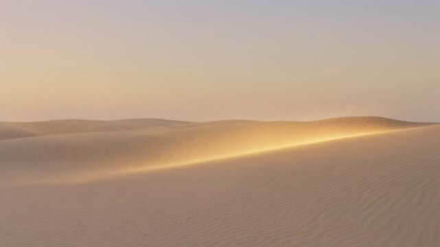 Golden sunlight shining over vast sand dunes in peaceful desert landscape at sunset