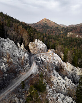 Winding Road Through Rocky Terrain in Općina Karlobag, Croatia