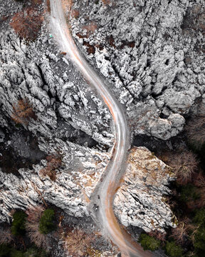 Winding Road Through Rocky Terrain in Općina Karlobag, Croatia