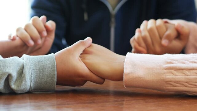 Group of people praying. Christian worship and pray. Christian group of people holding hands praying worships together to believe