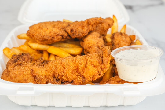 Crispy fried chicken tenders with fries and ranch dip