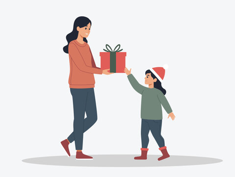 Mother gives christmas gift to her beautiful daughter
