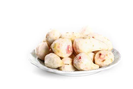 Fresh Taro Root Vegetables with Red Sprouts on White Plate
