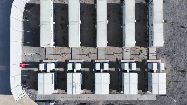 Aerial view of modular container housing units arranged in orderly rows on a construction site