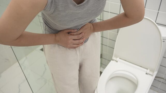 Constipation and diarrhea in bathroom. Hurt woman touch belly  stomach ache painful. colon inflammation problem, toxic food, abdominal pain, abdomen, constipated in toilet, stomachache, Hygiene