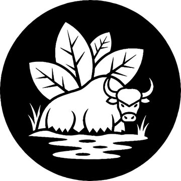 Water buffalo resting in water with foliage above.