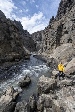 Tourist in a gorge, Drekagil, gorge in the crater rim of Askja volcano, Dyngjufj&ouml;ll mountain massif, Iceland