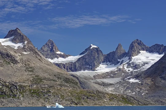 Ragged mountains with snow and blue glaciers under a clear sky, Tasilaq, Arctic, Greenland, Denmark