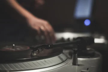 Night party with scratch dj playing vinyl © photopixel