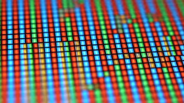 Macro view of RGB pixels on a digital screen.