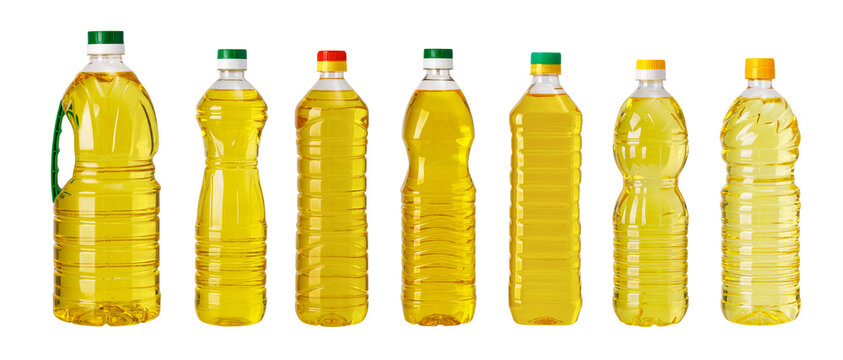 Cooking oil varieties in plastic bottles presenting essential food ingredient