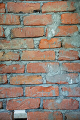 Fototapeta premium Close up of an old weathered brick wall texture