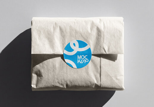 Round Sticker Mockup on Wrapped Tissue Paper Packaging