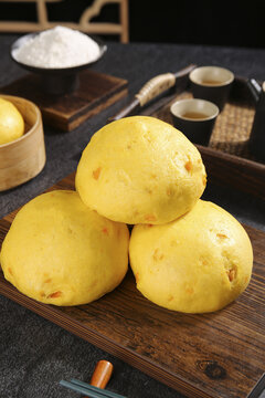 Traditional Chinese Yellow Pumpkin Steamed Buns Handmade Henan Shandong Cuisine on Wooden Board